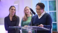 Three female CPTR members address audience during event.